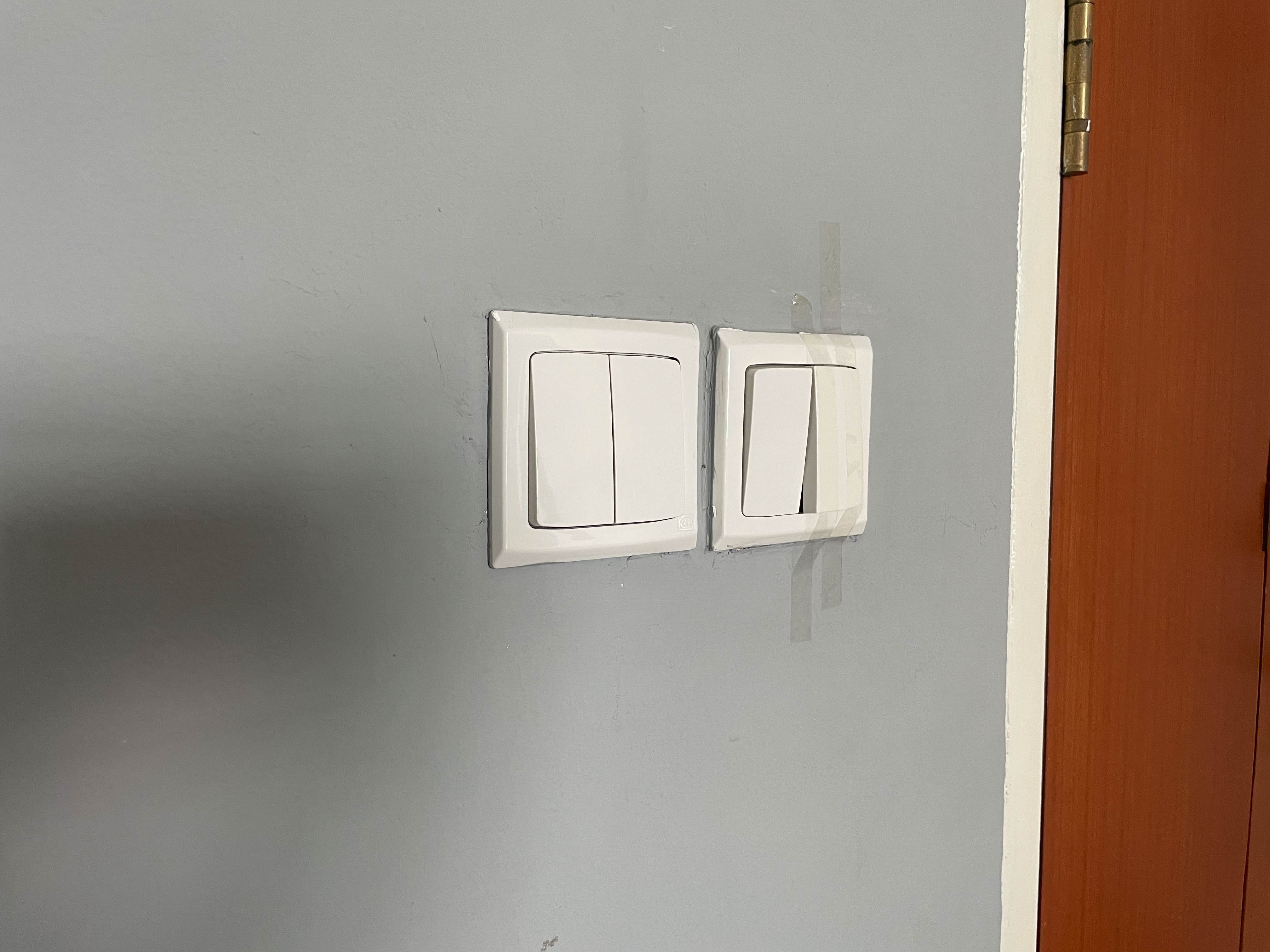 A switch that was taped up because it is broken