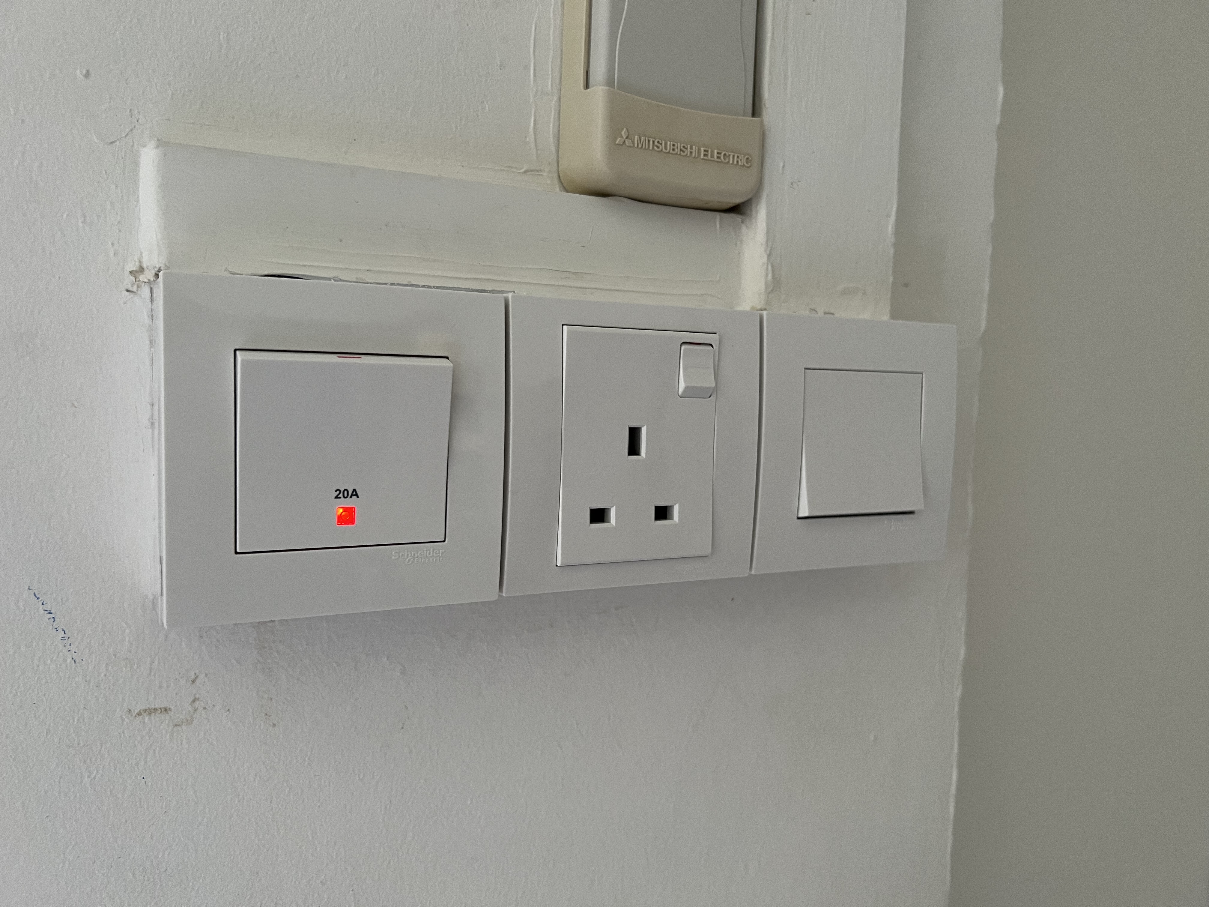 A water heater switch, single socket, and one-gang switch we installed