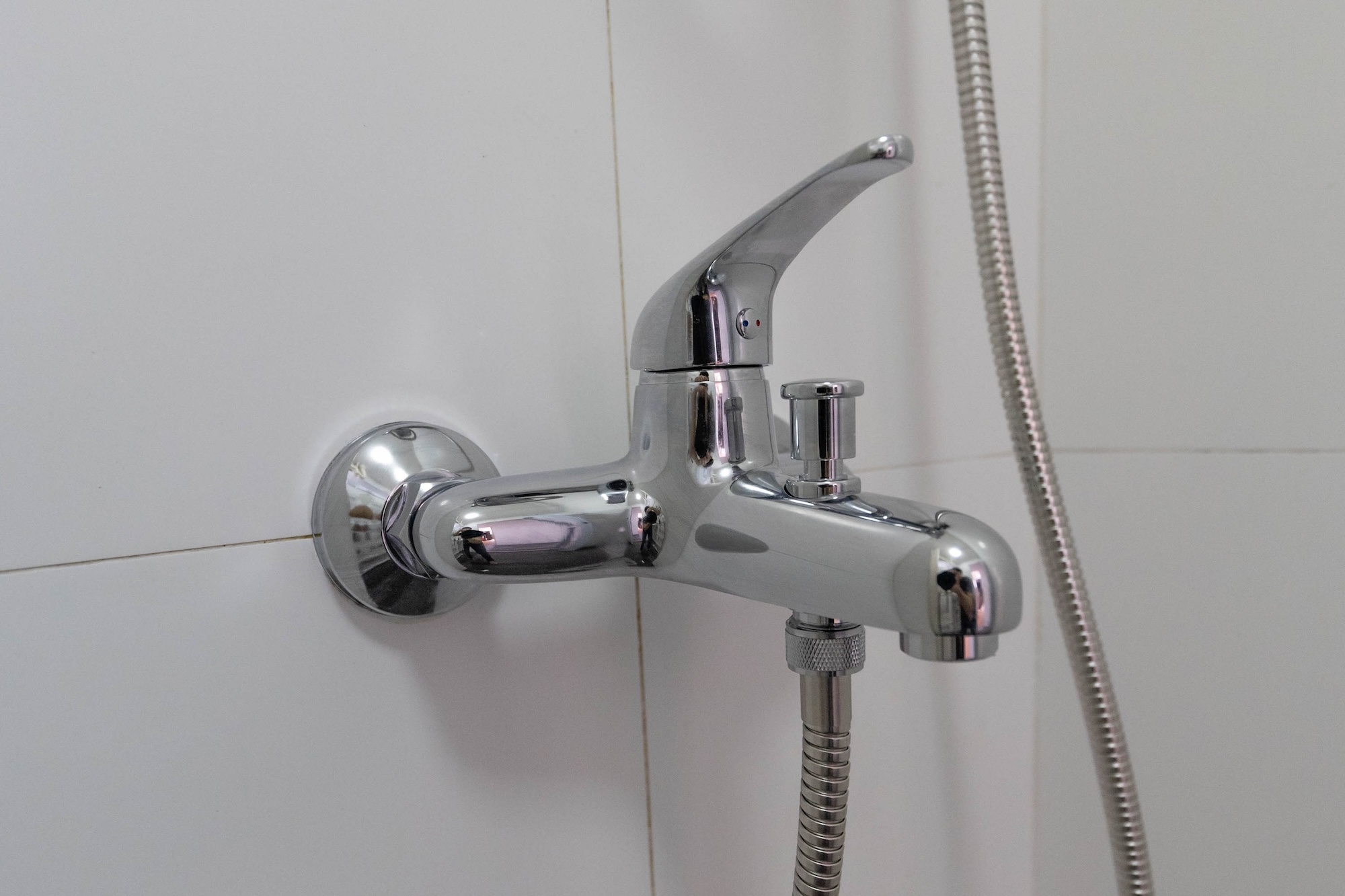 photo of a shower mixer tap installed to replace one that was leaking
